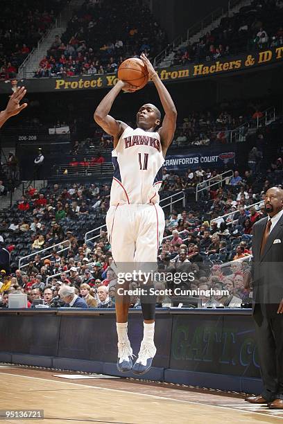 Jamal Crawford of the Atlanta Hawks shoots a jump shot during the game against the New Jersey Nets at Philips Arena on December 13, 2009 in Atlanta,...