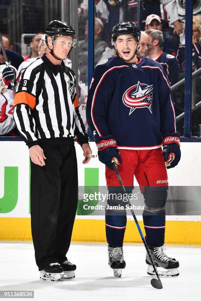 Referee Dan O'Rourke and Zach Werenski of the Columbus Blue Jackets talk before a face off against the Washington Capitals in Game Six of the Eastern...