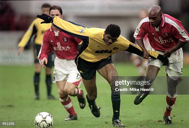 Nwankwo Kanu of Arsenal shrugs off the attention from Richard Rufus of Charlton Athletic during the FA Carling Premiership match played at The...