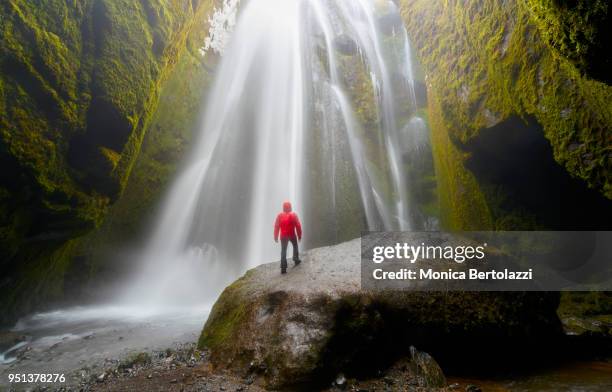 secret falls - red coat stock pictures, royalty-free photos & images