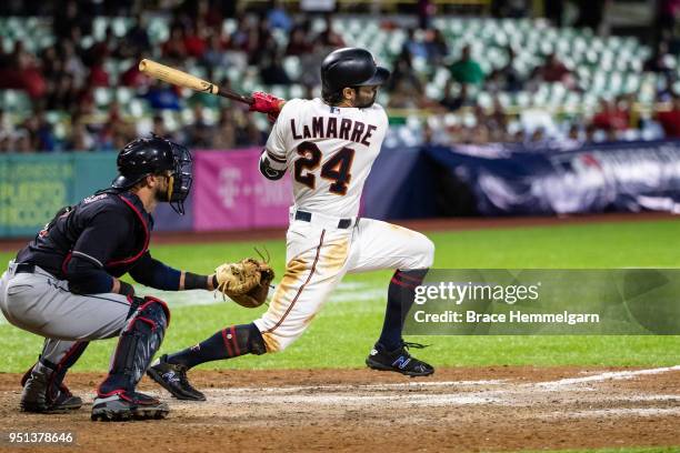 Ryan LaMarre of the Minnesota Twins bats and hits a walk-off single against the Cleveland Indians at Hiram Bithorn Stadium on Tuesday, April 18, 2018...