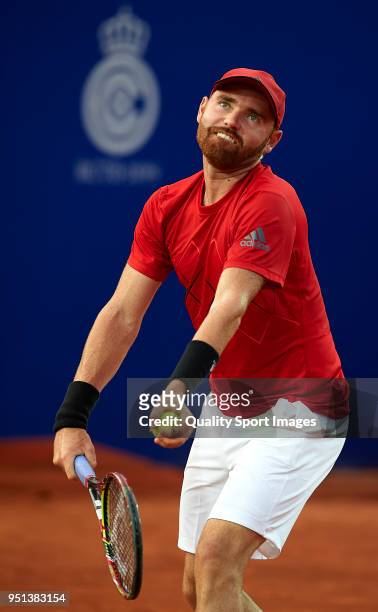 Bjorn Fratangelo of the United States serves against Pablo Andujar of Spain in their match during day three of the ATP Barcelona Open Banc Sabadell...