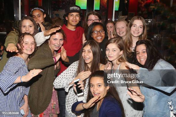 Xolo Mariduena poses with fans as he promotes his tv series "Cobra Kai" at Planet Hollywood Times Square on April 25, 2018 in New York City.