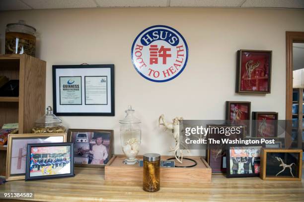 The storefront at Hsu's Ginseng Enterprise in Wausau, Wisconsin displays record breaking sizes of ginseng as well as memorable photos and awards...
