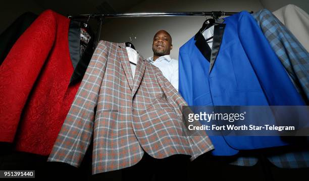 Carlton Dixon, owner and C.E.O. Of Simply Sophisticate, is photographed with some suits on April 19, 2018 in Grand Prairie, Texas. Dixon will dress...