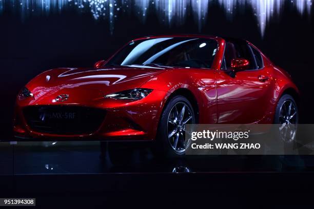 Mazda MX-5RF car is displayed at the Beijing auto show on April 26, 2018. - Global carmakers touted their latest electric and SUV models in Beijing...