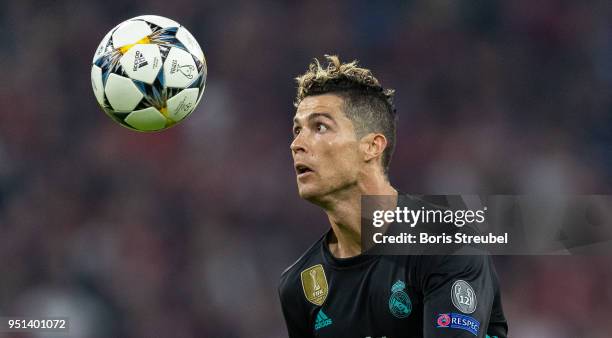 Cristiano Ronaldo of Real Madrid controls the ball during the UEFA Champions League Semi Final First Leg match between Bayern Muenchen and Real...