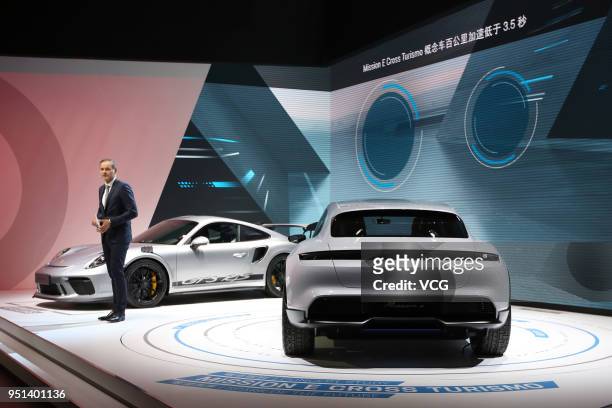 Porsche chief executive Oliver Blume introduces Porsche 911 GT3 RS and Porsche Mission E Cross Turismo car during the Auto China 2018 at China...