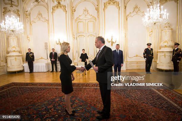 Newly appointed Slovak Interior Minister Denisa Sakova shakes hands with Slovak President Andrej Kiska during her swearing-in ceremony at the...