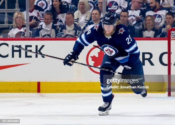 Patrik Laine of the Winnipeg Jets follows the play down the ice during first period action against the Minnesota Wild in Game Five of the Western...