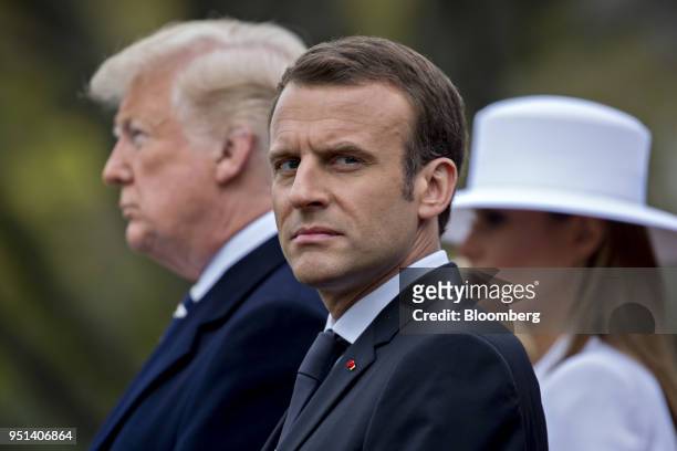 Emmanuel Macron, France's president, center, listens as U.S. President Donald Trump, left, speaks at an arrival ceremony during a state visit on the...