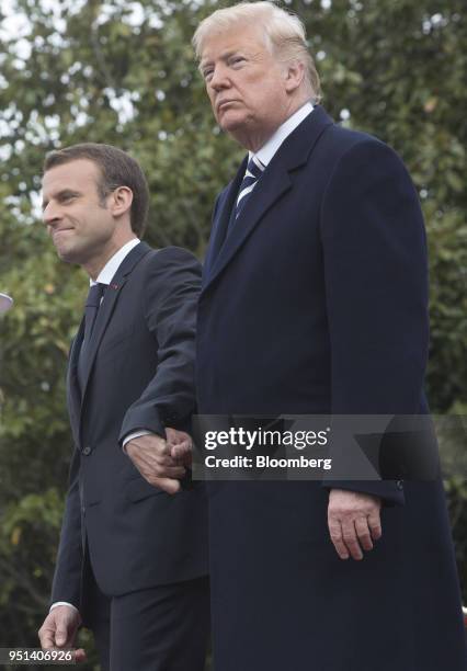 President Donald Trump, right, and Emmanuel Macron, France's president, stand for photographs during a state visit at the White House in Washington,...