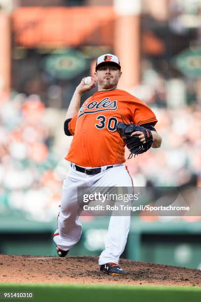 Chris Tillman of the Baltimore Orioles pitches during the game against the Cleveland Indians at Oriole Park at Camden Yards on Saturday, April 21,...