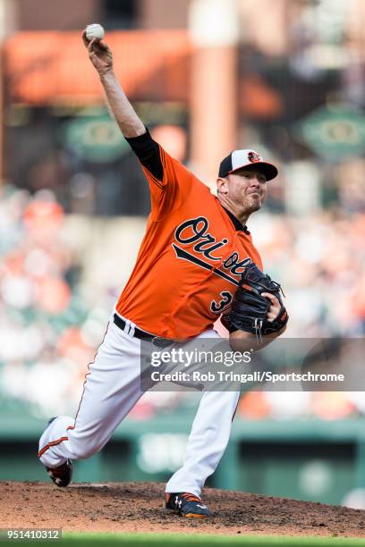 Chris Tillman of the Baltimore Orioles pitches during the game against the Cleveland Indians at Oriole Park at Camden Yards on Saturday, April 21,...