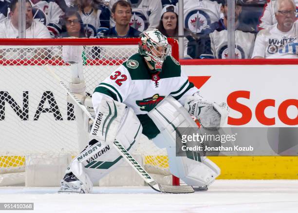 Goaltender Alex Stalock of the Minnesota Wild guards the net during first period action against the Winnipeg Jets in Game Five of the Western...