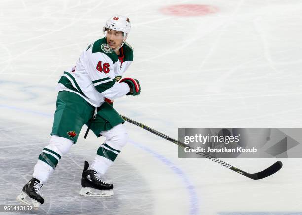 Jared Spurgeon of the Minnesota Wild keeps an eye on the play during second period action against the Winnipeg Jets in Game Five of the Western...