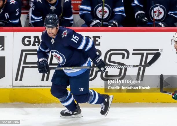Matt Hendricks of the Winnipeg Jets keeps an eye on the play during second period action against the Minnesota Wild in Game Five of the Western...