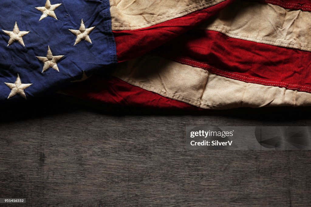 Old and worn American flag for Memorial Day or 4th of July