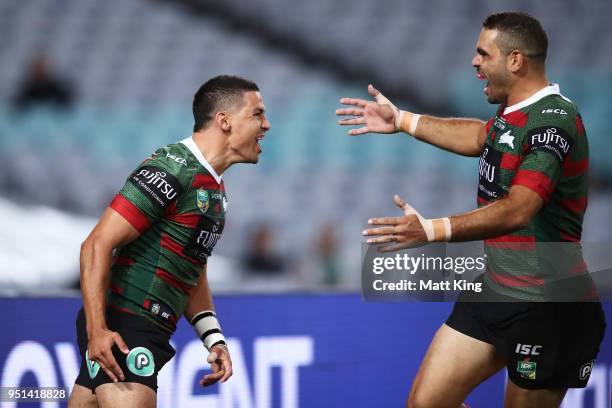Cody Walker of the Rabbitohs celebrates with Greg Inglis after scoring the first try in the NRL round eight match between the South Sydney Rabbitohs...