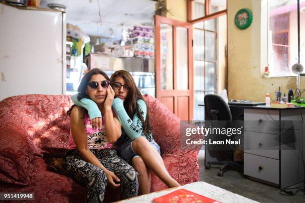 Reis-Buckler syndrome patient Diana, aged 17, sits with her mother Rosa at home on April 19, 2018 in Trujillo, Peru. Reis-Buckler corneal dystrophy...
