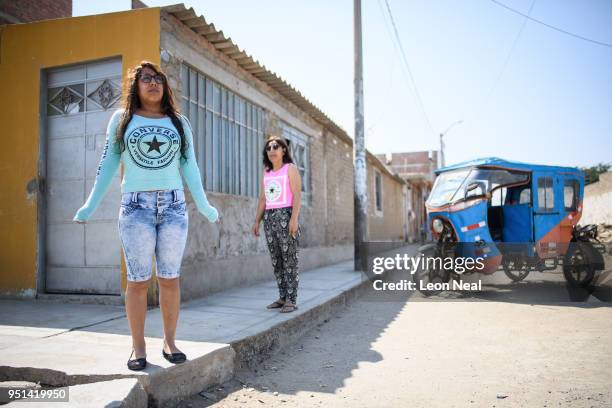 Reis-Buckler syndrome patient Diana, aged 17, poses with her mother Rosa near their home on April 19, 2018 in Trujillo, Peru. Reis-Buckler corneal...