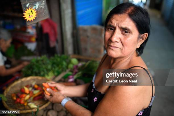 Cataract patient Obdulia, aged 60, struggles to see the products in her local market on April 19, 2018 in Trujillo, Peru. Having suffered with visual...