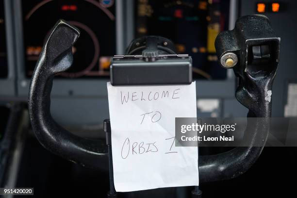 Sign on the cockpit joystick onboard the Orbis Flying Eye Hospital reads "Welcome to Orbis 1", on April 21, 2018 in Trujillo, Peru. Founded in 1982...