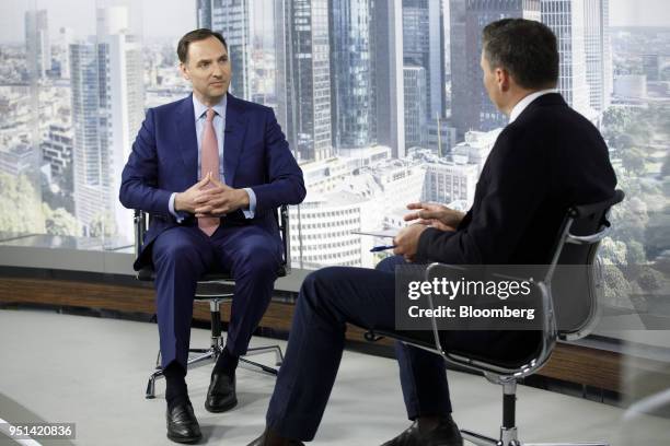 James von Moltke, chief financial officer of Deutsche Bank AG, left, pauses during a Bloomberg Television interview in Frankfurt, Germany, on...