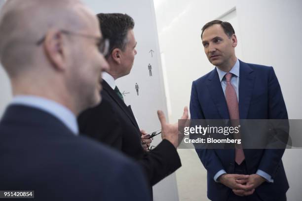 James von Moltke, chief financial officer of Deutsche Bank AG, right, speaks with Guy Johnson, anchor for Bloomberg Television, following a Bloomberg...