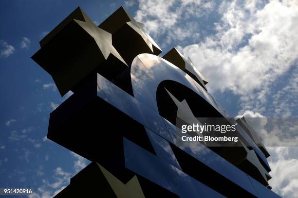 The euro sign sculpture stands in Frankfurt, Germany, on Wednesday, April 25, 2018. About 8,000 additional jobs may be created in Frankfurts banking...
