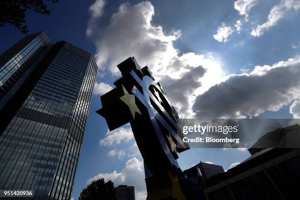 The euro sign sculpture stands near the former European Central Bank headquarters in Frankfurt, Germany, on Wednesday, April 25, 2018. About 8,000...