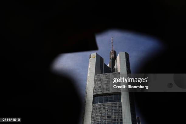 The Commerzbank AG logo sits on the bank's headquarters in Frankfurt, Germany, on Wednesday, April 25, 2018. About 8,000 additional jobs may be...