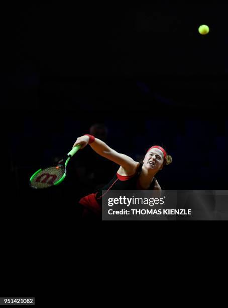 Latvia's Jelena Ostapenko serves the ball to Kazakhstan's Zarina Diyas during their match at the WTA Porsche Tennis Grand Prix in Stuttgart,...