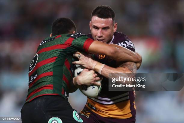 Darius Boyd of the Broncos is tackled in the NRL round eight match between the South Sydney Rabbitohs and the Brisbane Broncos at ANZ Stadium on...