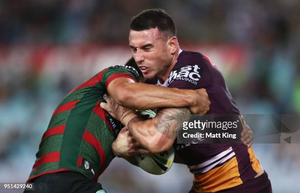 Darius Boyd of the Broncos is tackled in the NRL round eight match between the South Sydney Rabbitohs and the Brisbane Broncos at ANZ Stadium on...