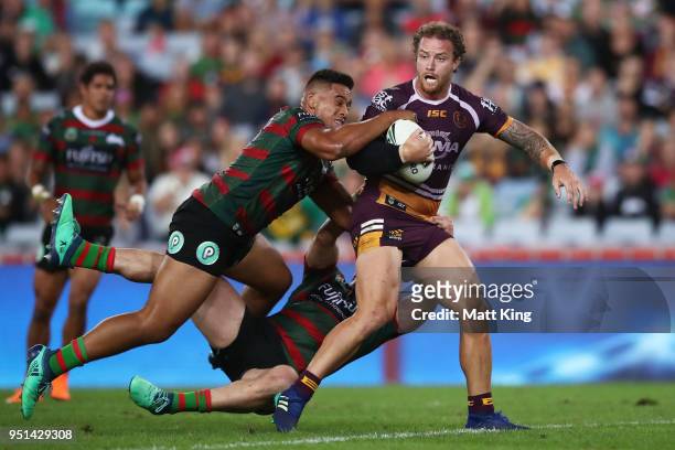 Korbin Sims of the Broncos is tackled in the NRL round eight match between the South Sydney Rabbitohs and the Brisbane Broncos at ANZ Stadium on...