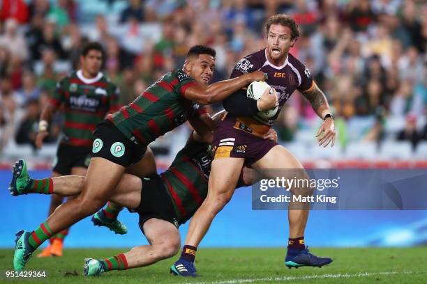 Korbin Sims of the Broncos is tackled in the NRL round eight match between the South Sydney Rabbitohs and the Brisbane Broncos at ANZ Stadium on...