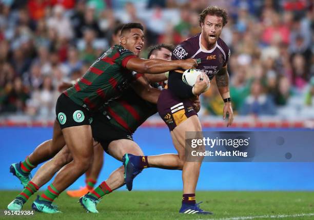 Korbin Sims of the Broncos is tackled in the NRL round eight match between the South Sydney Rabbitohs and the Brisbane Broncos at ANZ Stadium on...