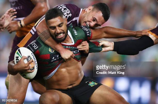 Robert Jennings of the Rabbitohs is tackled by Jaydn SuÕa of the Broncos in the NRL round eight match between the South Sydney Rabbitohs and the...