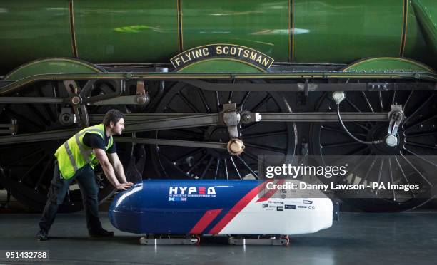 Jonny Lees pushes Britain's first Hyperloop prototype developed past World-famous steam locomotive the Flying Scotsman during a photocall at the...