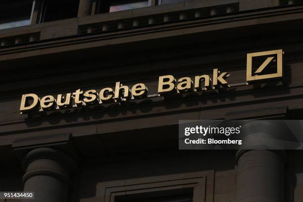 Deutsche Bank AG signage sits above the entrance to a bank branch in Frankfurt, Germany, on Wednesday, April 25, 2018. Germanys largest lender will...