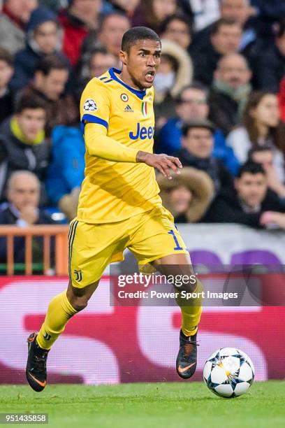 Douglas Costa of Juventus in action during the UEFA Champions League 2017-18 quarter-finals match between Real Madrid and Juventus at Estadio...