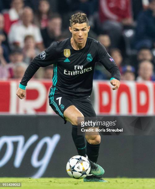 Cristiano Ronaldo of Real Madrid runs with the ball during the UEFA Champions League Semi Final First Leg match between Bayern Muenchen and Real...