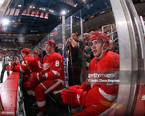 Drew Miller of the Detroit Red Wings, Justin Abdelkader, Darren Helm, Mattias Ritola, coach Mike Babcock and equipment manager Paul Boyer watch the...