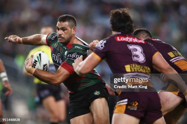 Greg Inglis of the Rabbitohs is tackled during the NRL round eight match between the South Sydney Rabbitohs and the Brisbane Broncos at ANZ Stadium...