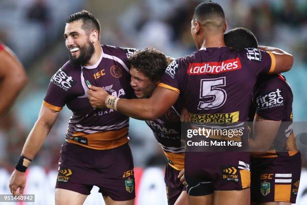 James Roberts of the Broncos celebrates with team mates after scoring a try during the NRL round eight match between the South Sydney Rabbitohs and...