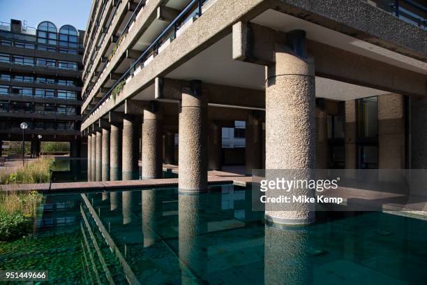 Brutalist architecture exterior from the Highwalk in the Barbican Estate in the City of London, England, United Kingdom. The Barbican Centre is a...