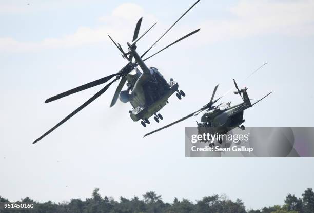 Sikorsky CH-53 and an NHIndusries NH90 helicopters of the Bundeswehr, the German armed forces, participate in a special forces simulation of...