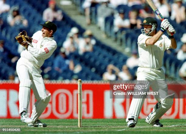 Australian batsman Steve Waugh snicks a ball past South African wicketkeeper Dave Richardson on the third day of the first Test match in Melbourne 28...