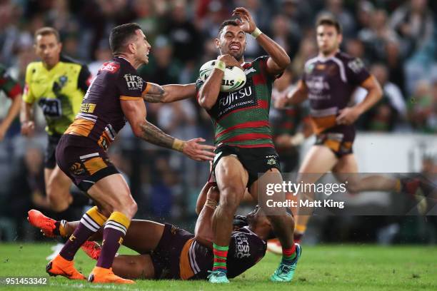 Alex Johnston of the Rabbitohs is tackled during the NRL round eight match between the South Sydney Rabbitohs and the Brisbane Broncos at ANZ Stadium...